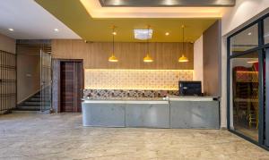 The lobby or reception area at Treebo Imperia, Kommadi