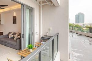 a living room with a couch on a balcony at SeaView R&F 4pax-1BR 10mis to CIQ JBSentral CitySquare in Johor Bahru