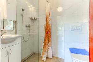 a bathroom with a shower and a sink at Villa Drago in Marina +155 photos