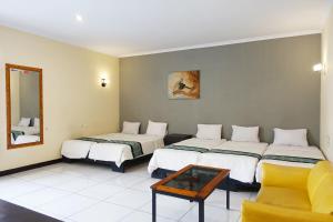 Postel nebo postele na pokoji v ubytování Saung Balibu Hotel + 37 fotografií
