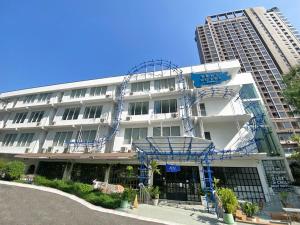 a building with blue scaffolding on the side of it at Beat Hotel Bangkok in Bangkok
