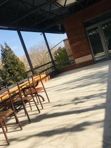 a group of benches sitting outside of a building at Bardy guest house in Chʼiva
