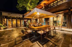 Patio nebo venkovní prostory v ubytování 丽江古城御府庭院客栈