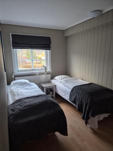 Postel nebo postele na pokoji v ubytování Vertshuset Fannarheimr - Bed &Breakfast