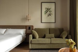 Postel nebo postele na pokoji v ubytování Batimont Suites & Apartments