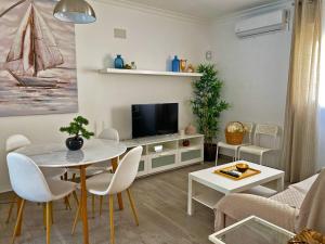Televízia a/alebo spoločenská miestnosť v ubytovaní Apartamento Alván - Ole Solutions