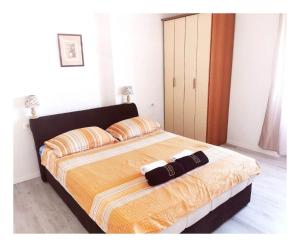 Ένα ή περισσότερα κρεβάτια σε δωμάτιο στο Apartments Darka