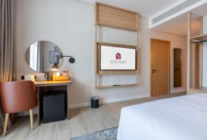 Vuode tai vuoteita majoituspaikassa West Walk Retaj Hotel