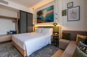 Vuode tai vuoteita majoituspaikassa West Walk Retaj Hotel