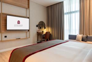 Vuode tai vuoteita majoituspaikassa West Walk Retaj Hotel