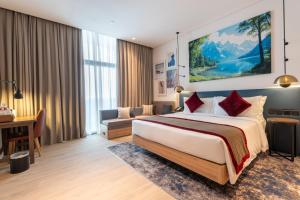 Vuode tai vuoteita majoituspaikassa West Walk Retaj Hotel