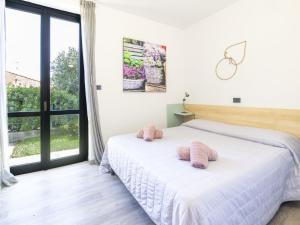 A bed or beds in a room at Apartment Le Margherita - SLR266 by Interhome