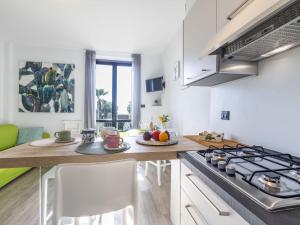 A kitchen or kitchenette at Apartment Le Margherita - SLR266 by Interhome Még 37 kép