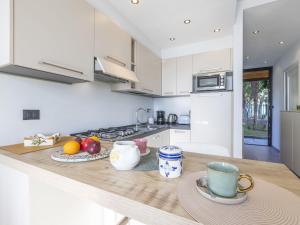 A kitchen or kitchenette at Apartment Le Margherita - SLR266 by Interhome