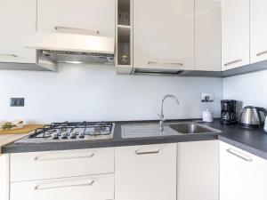 A kitchen or kitchenette at Apartment Le Margherita - SLR266 by Interhome
