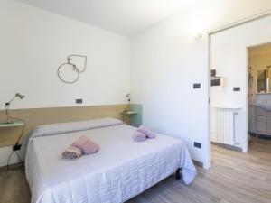 A bed or beds in a room at Apartment Le Margherita - SLR266 by Interhome