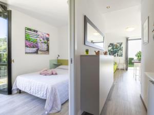 A bed or beds in a room at Apartment Le Margherita - SLR266 by Interhome
