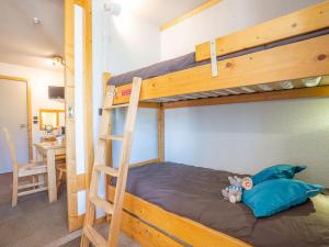 a bunk bed with a stuffed animal on the bottom bunk at Apartment Eskival 106 by Interhome in Val Thorens