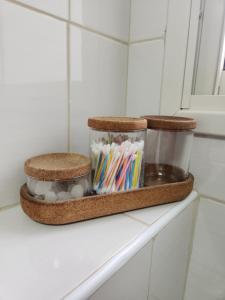 a bathroom shelf with a jar of toothbrushes at שקיעות מדבר in Yeroẖam +24 photos