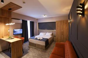 TV a/nebo společenská místnost v ubytování Nest Suites