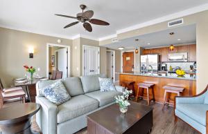 a living room with a couch and a kitchen at Honua Kai Resort And Spa By Maui Resort Rentals in Lahaina