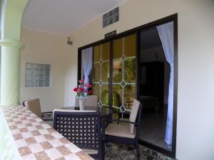 Anse aux Pins的住宿－綠色棕櫚自助式公寓，相簿中的一張相片