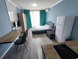 A bed or beds in a room at Apartments in Panorama Beach Vigo Nessebar