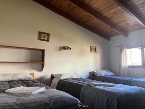 Postel nebo postele na pokoji v ubytování Casa Campo