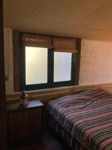 En eller flere senge i et værelse på La Pesebrera, Cabaña El Corral, Potrerillos