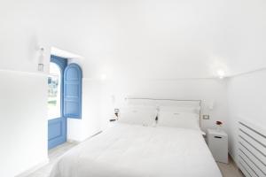Postel nebo postele na pokoji v ubytování Borgofreddo Luxury Suite