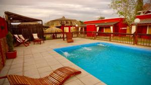 a swimming pool in the middle of a yard at La Aldea in San Rafael