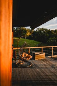 a swing on the deck of a house at Treedom in Prievidza +13 photos