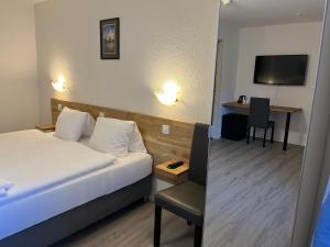 Postel nebo postele na pokoji v ubytování Hotel Drei Könige