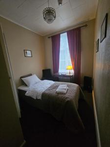 Postel nebo postele na pokoji v ubytování Eides Hotel