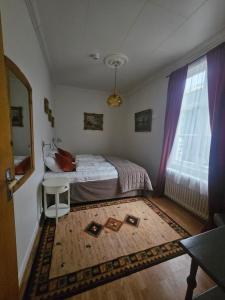Postel nebo postele na pokoji v ubytování Eides Hotel