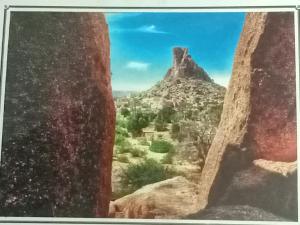 a view of the desert from a window in a canyon at Maison d'hôtes afoulki tafraout in Tafraout