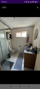 a bathroom with a shower and a toilet in it at Casa in Brasilia