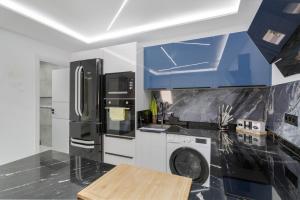 Kuchyň nebo kuchyňský kout v ubytování Apt Ruvi