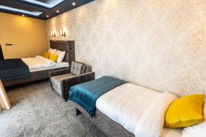 Ein Bett oder Betten in einem Zimmer der Unterkunft HOTEL LOBBY