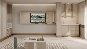 a living room with a table and a kitchen at Ducale Lara - Ultra All Inclusive in Lara