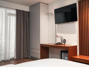 Postel nebo postele na pokoji v ubytování VM Resort & SPA