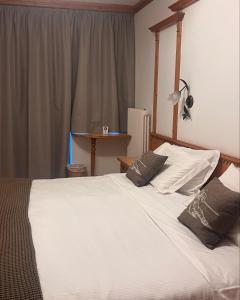 Postel nebo postele na pokoji v ubytování Hotel Valle Verde - Rent Ski & Bike