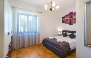 Ένα ή περισσότερα κρεβάτια σε δωμάτιο στο Three-Bedroom Apartment In Srinjine +18 φωτογραφίες