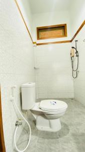 a bathroom with a toilet and a shower at Cocoa Home in Ban Ko Phrao