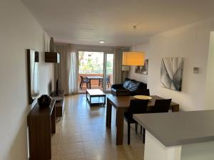 a living room with a couch and a table at Mar Menor Golf Resort 2 Bed Apartment in Los Martínez