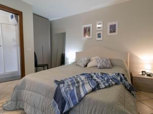 Ένα ή περισσότερα κρεβάτια σε δωμάτιο στο Welcomely - A Due Passi dal Lago