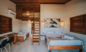 a room with two beds and a ladder in it at Casa Amado Atins in Atins +53 photos