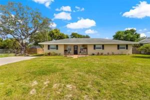 a home with a large grassy yard at Home in Clearwater Quiet Spacious close to beaches in Largo