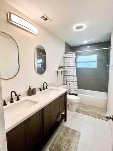 a bathroom with a sink and a tub and a toilet at Home in Clearwater Quiet Spacious close to beaches in Largo