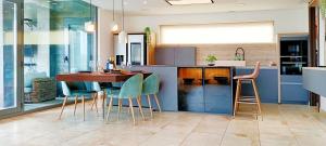 a kitchen with a wooden table and chairs at Casa Rural Villa Cruz in Caravaca de la Cruz